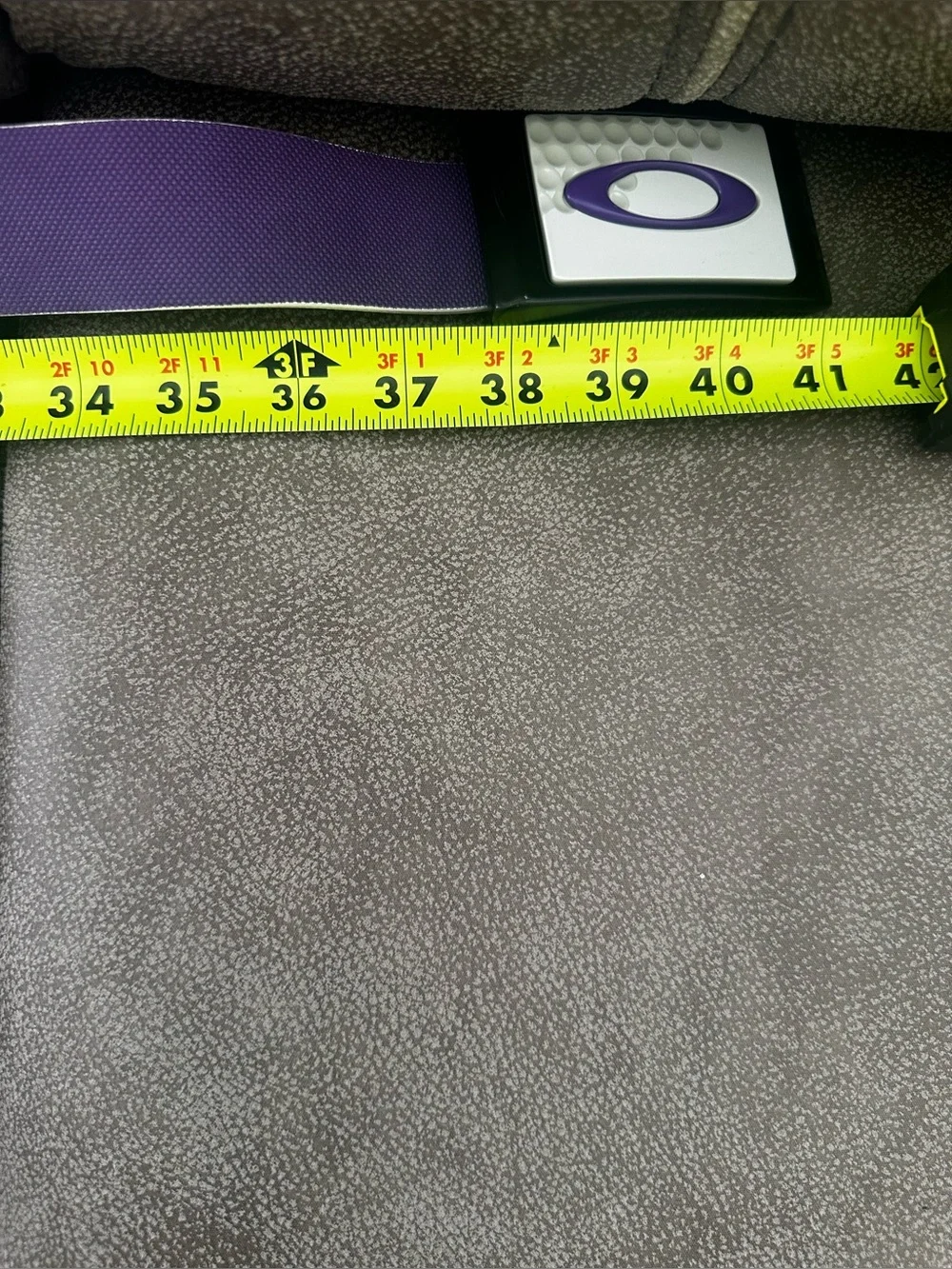 Oakley Belt Buckle with Purple Belt.